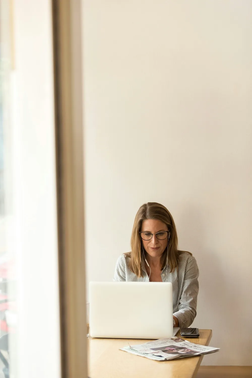 Modern office workspace with laptop and coffee